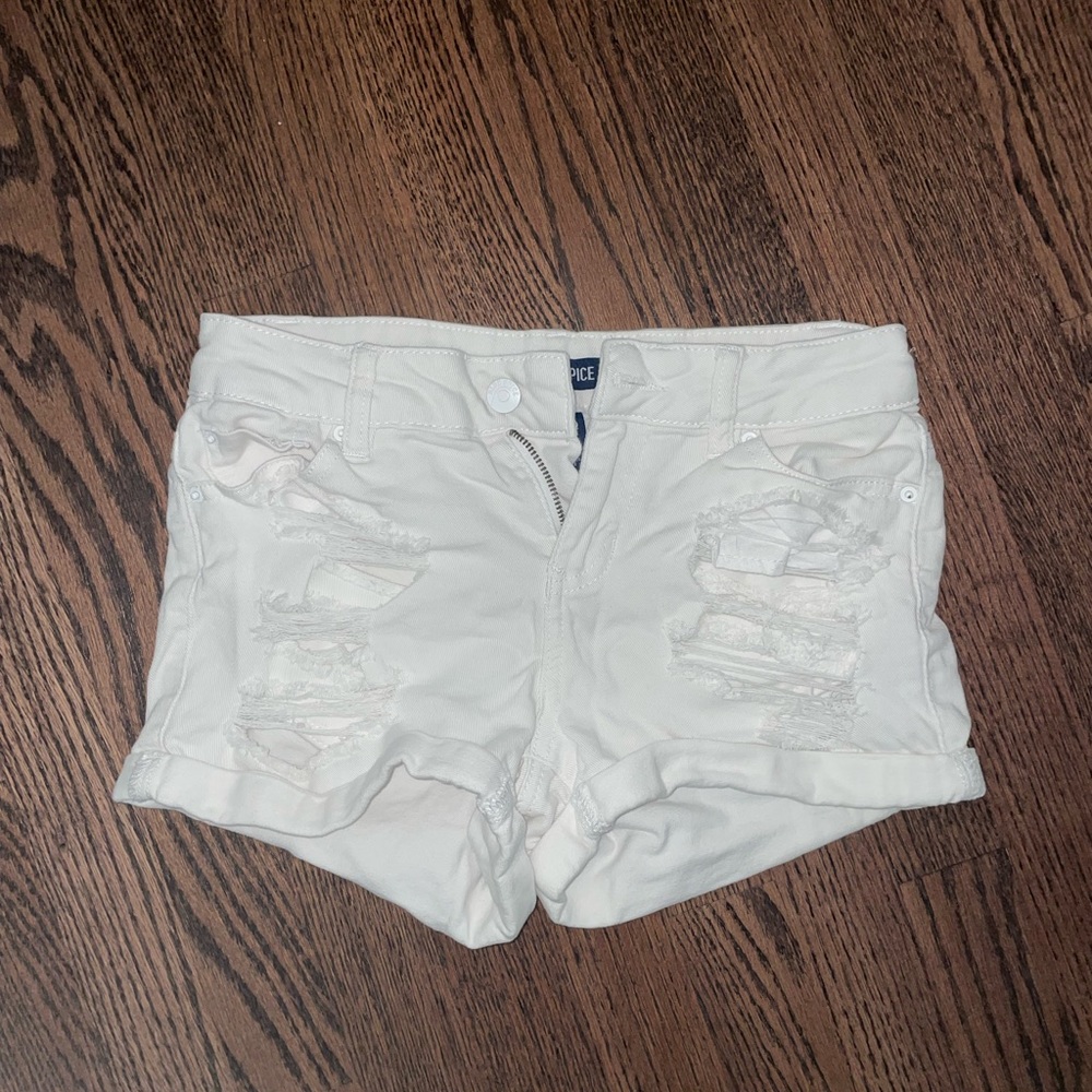 White ripped jean shorts by Blue Spice
